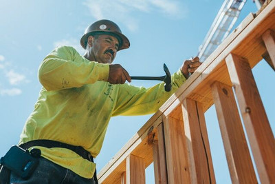 Construction worker wearing high visibility safety apparel