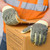 Worker wearing Kevlar® knit gloves with PVC dots for heavy-duty industrial tasks