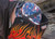 Welder wearing flame-resistant welding cap under a helmet