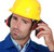Worker wearing QM24+ earmuff with hard hat on construction site