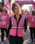 Woman Wearing Pink Vest For Awareness And Work