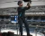 stadium ceiling repair worker with fall protection harness