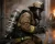 Firefighter wearing MSA SCBA breathing apparatus, face mask, helmet, gloves, and turnout gear while operating a hose during structural fire response