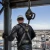 Worker using a steel cable self-retracting lifeline on an elevated jobsite