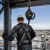 Worker using a steel cable self-retracting lifeline on an elevated jobsite