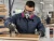 Worker wearing 3M 60925 Formaldehyde Organic Vapor P100 cartridges while applying wood finish in a workshop