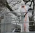 Worker wearing a white chemical protective coverall during industrial cleaning