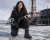 Female worker wearing Crossbow extreme cold safety boots in a snowy industrial worksite environment