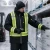 Worker wearing a -60°F soft shell extreme freezer jacket while scanning frozen inventory in a cold storage facility