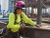 Metal fabrication worker wearing a pink LIFT DAX Fifty/50 full brim hard hat