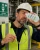 Construction worker using eyesaline eyewash