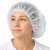 Worker wearing white disposable bouffant cap for vitamin manufacturing plant and hygiene control