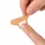 Latex-free woven fingertip bandage for minor cuts and scrapes