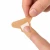 Latex-free woven fingertip bandage for minor cuts and scrapes