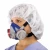Healthcare worker wearing a MSA Advantage reusable half-mask respirator with dual cartridges, disposable bouffant cap, and medical scrubs