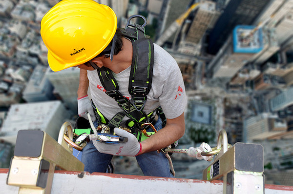 Worker using industrial fall protection equipment