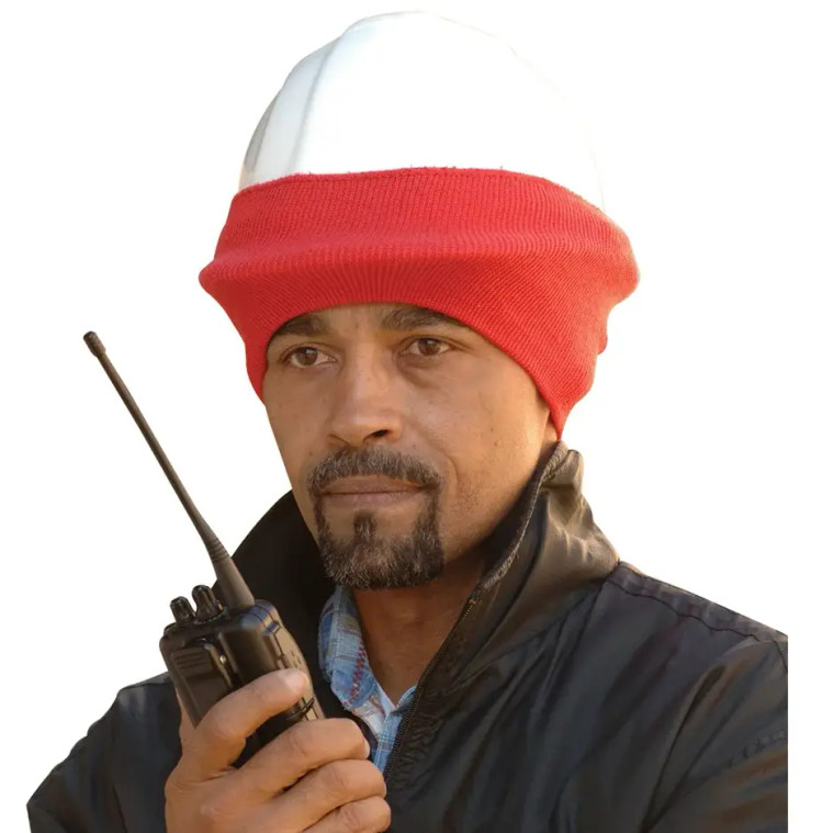 Construction worker wearing winter hard hat liner on cold outdoor job site