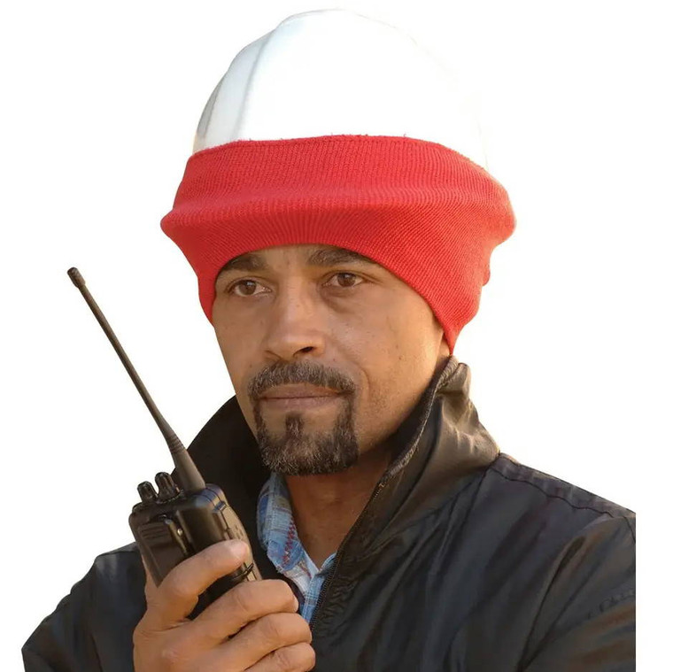 Construction worker wearing winter hard hat liner on cold outdoor job site