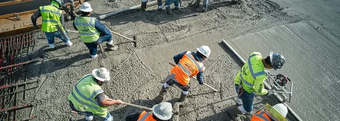 Construction workers wearing high-visibility personal protective equipment