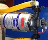 Shurflo pump. With spin-on wingnut fittings, pump is easily accessible for service. This means less downtime and more profit for you!