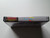 Spine view of a Cart Armor® Super C Contra Nintendo NES Premium 8-bit Clamshell Case