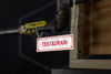 Test & Drain Sign | 6 in. x 2 in. | White w/ Red Letters | Installed
