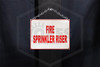 Fire Sprinkler Riser Sign | 9 in. x 7 in. | White w/ Red Letters | Installed