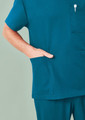 A unisex pulse v-neck scrub top in teal, featuring short sleeves and a front pocket.