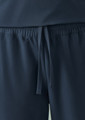 Navy women's jogger scrub pants with an elastic waistband and drawstring detail. Features smooth fabric and a logo.