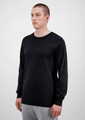 A black long sleeve men's t-shirt displayed on a model, featuring a simple design and fitted style.