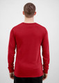 A red long sleeve men's tee viewed from the back, featuring a simple design and a subtle logo.