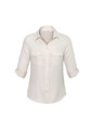 A women's long sleeve button-up shirt in cream, featuring two front pockets and rolled-up sleeves. It has a logo.