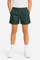 Kids' sports shorts in dark green with an elastic waistband and side pockets, paired with white shoes and socks.
