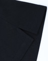A black cotton/poly pique polo shirt showcasing the folded collar and sleeve detail. It has a logo on the fabric.