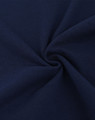 A close-up view of dark navy cotton/poly pique fabric, showcasing its texture and weave.