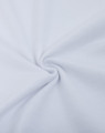 A close-up of white cotton/poly pique fabric, featuring a smooth, textured surface with a spiral twist.