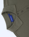 An olive green cotton/poly pique short-sleeve polo shirt with a collar and buttons, featuring a branding label.