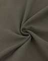 A close-up of dark olive green fabric with a soft texture, featuring a pique weave pattern.