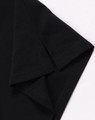 A black ultrafine cotton pique polo featuring a folded sleeve, with a small logo on the fabric.