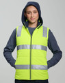 A unisex hi-vis hooded puffer vest in bright yellow with reflective stripes, worn by a model.