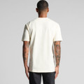 A classic cream T-shirt featuring short sleeves and a rear view, with a logo on the back.