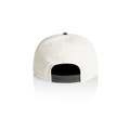 A two-tone cap in cream and black, featuring a snapback closure and a smooth finish at the back.