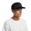 A black foam trucker cap featuring a structured front and mesh panels, worn by a model with a plain white t-shirt.