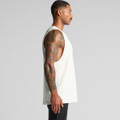A light-coloured singlet tank top with a loose fit, featuring side cutouts and a logo.