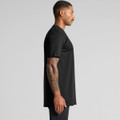 A black Classic Plus Tee [+5cm] featuring a straight cut and a subtle logo. Displayed on a male model in profile view.