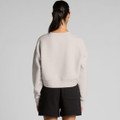 A light grey crop crew jumper viewed from the back, paired with black shorts. The design features a simple silhouette and a logo.