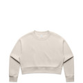 A cream-coloured crop crew jumper with a relaxed fit and long sleeves. It features a small logo.