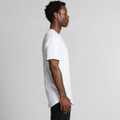 A white Staple Curve Tee displayed on a model, showcasing its side profile and relaxed fit.