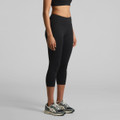 Black mid-length leggings displayed on a model, paired with athletic shoes, featuring a simple design and a logo.