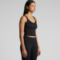 A black active bra tank with a V-neckline, displayed on a model in a side profile view, showcasing its fitted design.